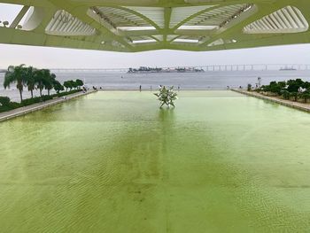 Scenic view of swimming pool by lake