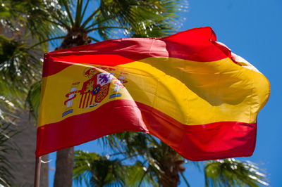 Low angle view of flag against sky