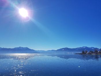 Scenic view of lake against blue sky