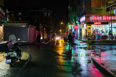 Wet city street during night
