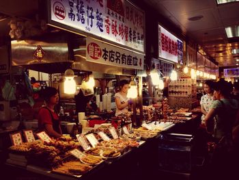 People at market stall