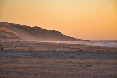 Scenic view of sea against clear sky during sunset