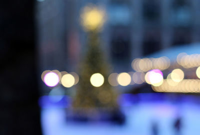 Defocused image of illuminated lights at night