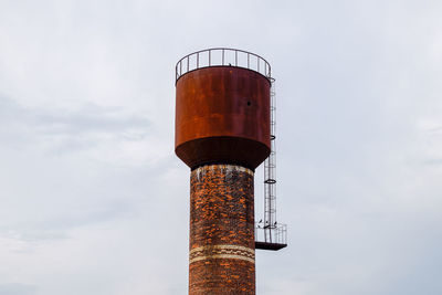 Low angle view of water tower against sky