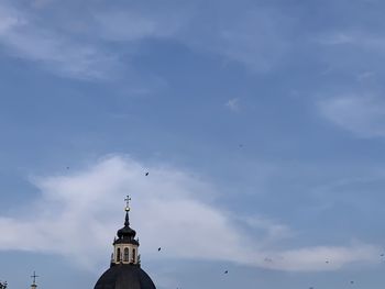 Low angle view of bell tower against sky