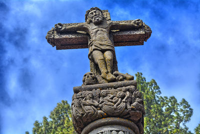 Low angle view of statue against sky