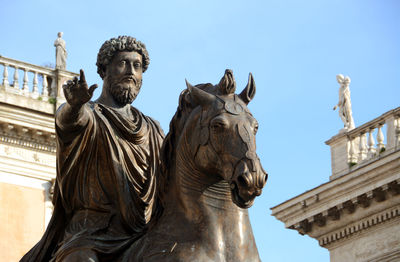 Low angle view of statue against sky