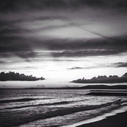 Scenic view of sea against cloudy sky
