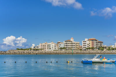 Inflatable slide for water sports, jet ski and motor boating in hamakawa fishing port in okinawa.