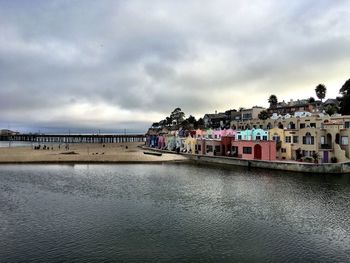 Buildings at beach against sky