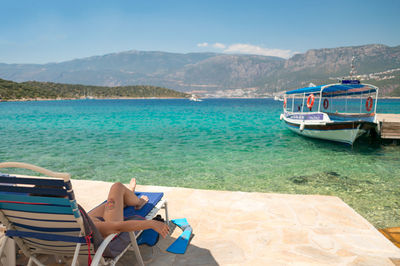 View of lounge chairs on beach