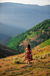 Woman looking at mountains