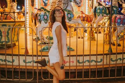 Full length of young woman at amusement park