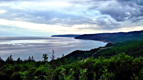 Scenic view of sea against cloudy sky