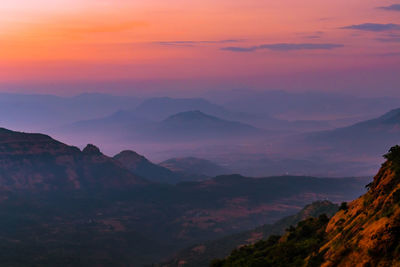 Scenic view of mountains against sky during sunset