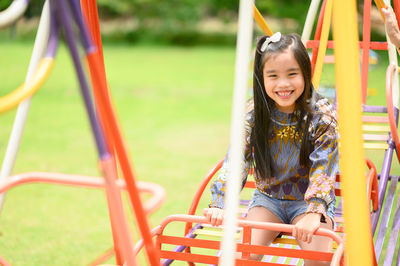 Portrait of smiling girl in playground