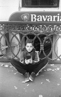 Portrait of boy sitting outdoors