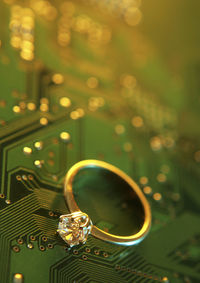 Close-up of wedding ring on motherboard