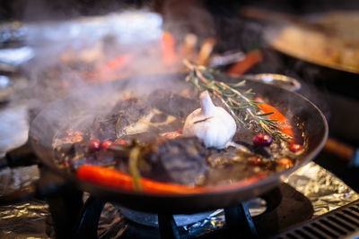 High angle view of food in cooking pan on stove