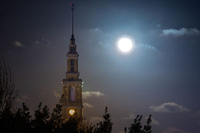 Low angle view of illuminated building against sky at night