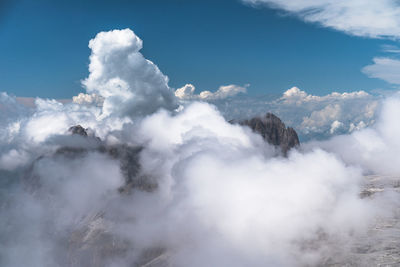 Low angle view of volcanic mountain against sky