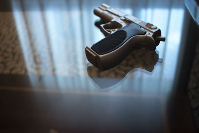 High angle view of gun on table