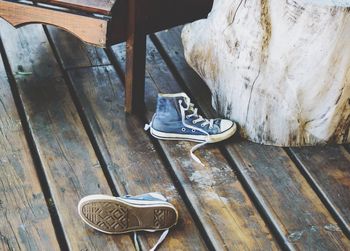 High angle view of shoes on wooden table