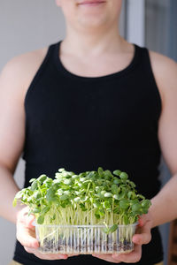 Midsection of woman holding food