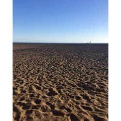 Scenic view of beach against clear sky