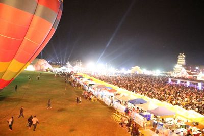 Group of people in hot air balloon at night