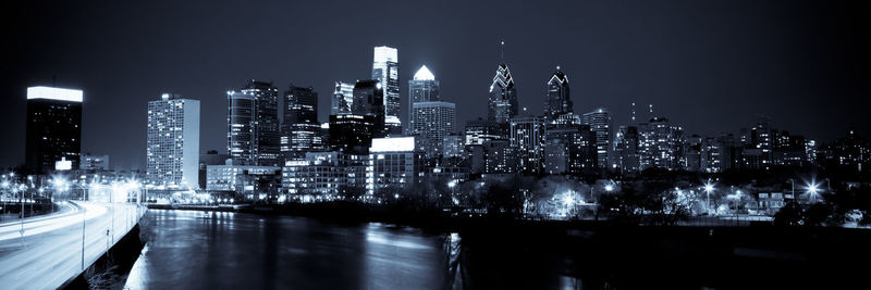 Illuminated modern buildings in city at night