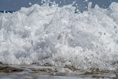 Close-up of ice splashing in sea