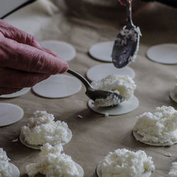 Cropped hand of person preparing food