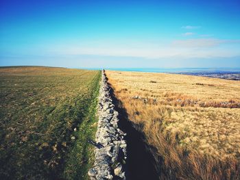 Scenic view of land against sky