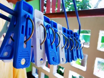 Close-up of clothespins hanging on clothesline