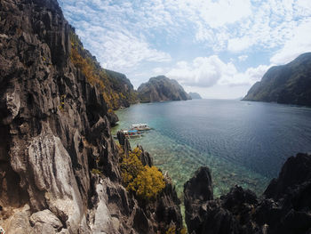 Scenic view of sea against cloudy sky