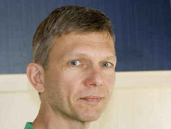 Portrait of man against wall