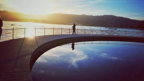 Scenic view of sunset over river