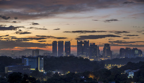 High angle view of buildings against sky during sunset