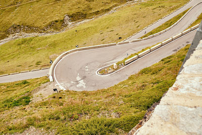 High angle view of road amidst green landscape