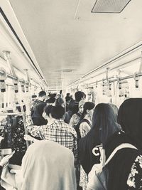 Group of people on railroad station platform