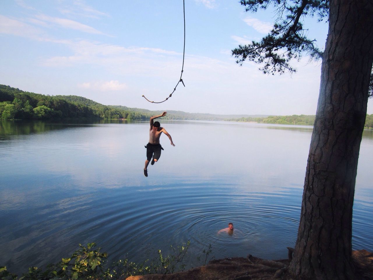 water, full length, leisure activity, lifestyles, lake, tranquility, tree, rear view, tranquil scene, nature, beauty in nature, men, scenics, vacations, fishing, reflection, adventure, sky