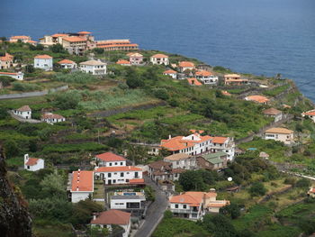 High angle view of town by sea