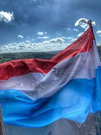 Low angle view of flag against the sky