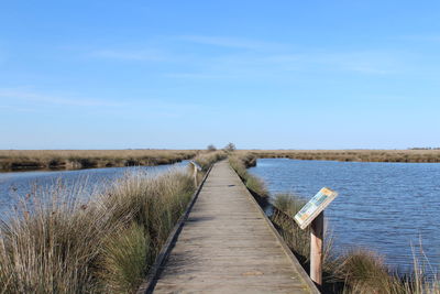 Pier over sea against sky