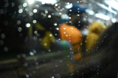 Close-up of wet window at night