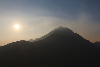 Scenic view of mountains against sky during sunset