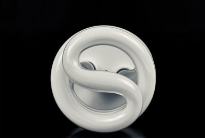 Close-up of electric lamp against black background