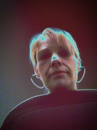 Portrait of mature man against black background