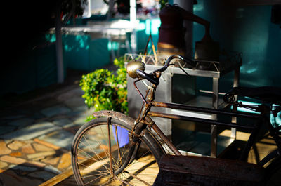 Bicycle parked in basket at night